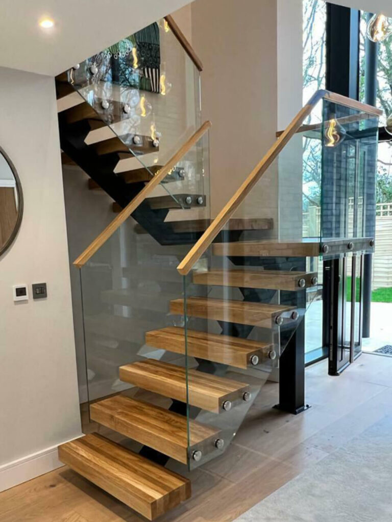 Oak floating staircase with glass panel guardrails